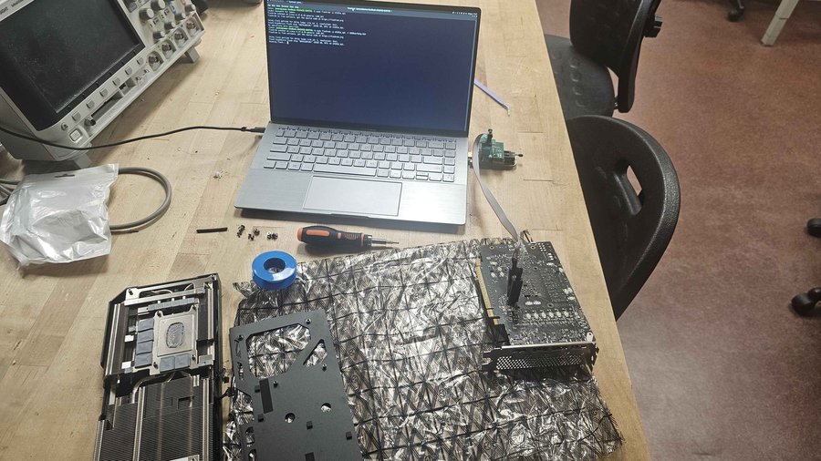 Flashrom terminal session next to a disassembled Arc B580
